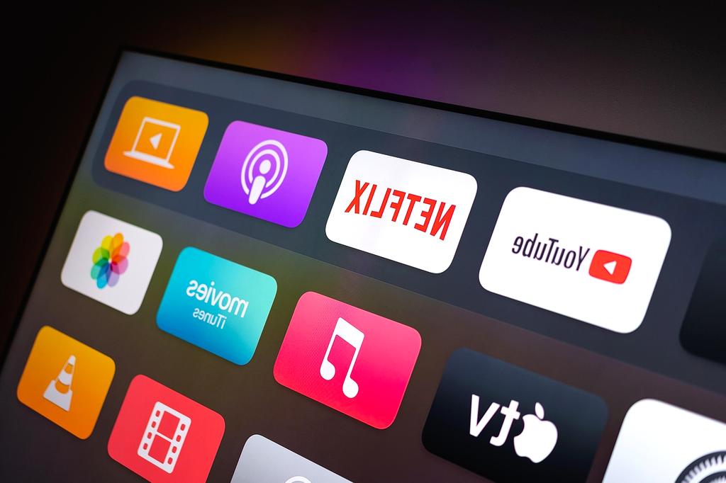 Person streaming movie on tablet